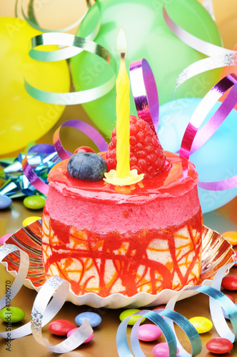 Photo: Colorful birthday cake with candle Colorful birthday cake with candle
