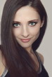 Young woman with healthy long hair and green eyes looking. Close Young woman with healthy long hair and green eyes looking. Close