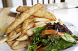 Fried fish and potatoes with salad Fried fish and potatoes with salad