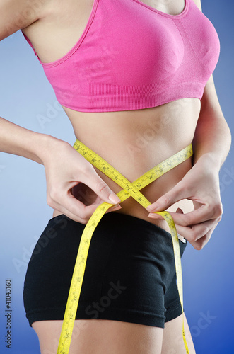 Photo: Young lady in dieting concept Young lady in dieting concept