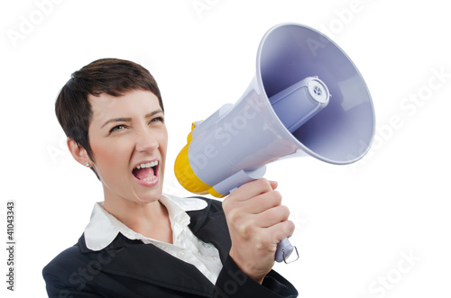 Photo: Young business lady screaming to loudspeaker Young business lady screaming to loudspeaker