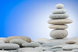 Pebbles stack against gradient background