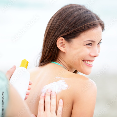 Photo: Sunscreen lotion on beach Sunscreen lotion on beach