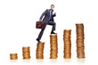 Businessman climbing gold coins stacks
