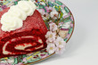 Red velvet roll cake and pink blossoms Red velvet roll cake and pink blossoms