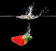 fresh strawberry dropping into water fresh strawberry dropping into water