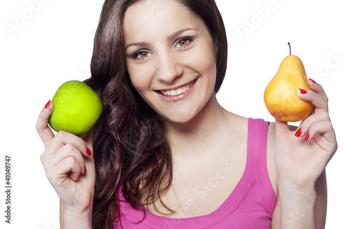 Photo: Young woman holding an apple and a pear Young woman holding an apple and a pear