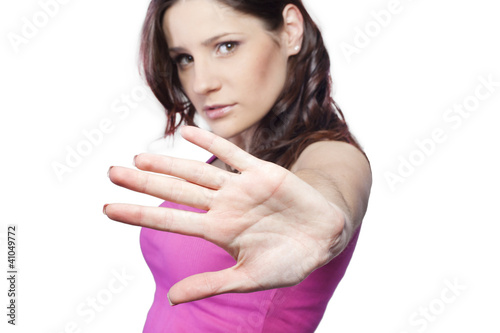 Photo: Young pretty woman making stop sign Young pretty woman making stop sign
