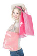 happy teenage girl with pink shopping bags