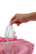 woman's hand taking a piece of tissue paper