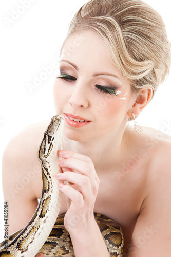 Photo: Beautiful woman holding Python on isolated white Beautiful woman holding Python on isolated white