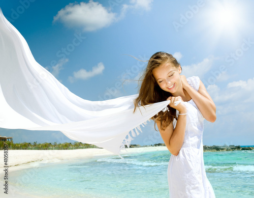 Photo: Beautiful Girl With White Scarf on The Beach Beautiful Girl With White Scarf on The Beach