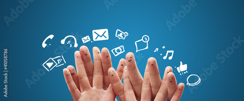 Photo: Happy group of finger smileys with social chat sign Happy group of finger smileys with social chat sign