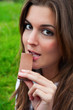 Photo: Mujer comiendo chocolate Mujer comiendo chocolate