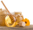 honey in glass and wood pot isolated on white honey in glass and wood pot isolated on white