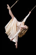 Young woman gymnast in white dress on rope