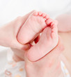 Baby feet in mommy's hands