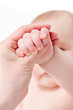 Mother massaging her baby