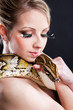attractive nude blond woman with python on black attractive nude blond woman with python on black
