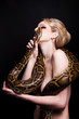 Photo: Kiss of attractive nude blond woman with python on black Kiss of attractive nude blond woman with python on black