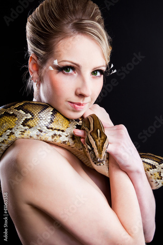 Photo: attractive nude blond woman with python on black attractive nude blond woman with python on black