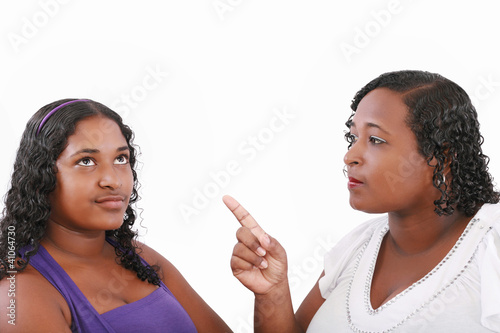 Photo: mother warn her daughter for bad behavior, isolated on white mother warn her daughter for bad behavior, isolated on white