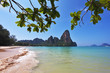 The white sand on the beach and cliffs.