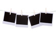 Photo paper hanging on the clothesline isolated on white