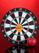 Darts with a sticker symbolizing health on colorful background Darts with a sticker symbolizing health on colorful background