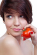 Young caucasian girl with tomato