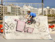 boy rides his scooter at the skate park