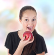 teenager fun eating a red apple