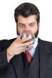 Businessman tasting a glass of whisky Businessman tasting a glass of whisky