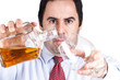 Businessman pouring a glass of whisky Businessman pouring a glass of whisky