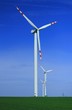 Wind turbines over blue sky