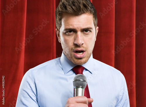 Photo: Man using a microphone Man using a microphone