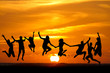 Silhouette O Kids Jumping On B...