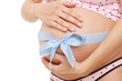 Closeup of a pregnant woman touching her belly