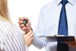 A male realtor giving keys to a woman