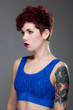 Beautiful young female in blue top
