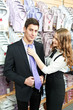 man and assistant at apparel clothes shopping