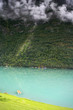 Azure relaxing lake scenery with boat in mountains Azure relaxing lake scenery with boat in mountains