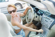 Woman driving on a parking lot