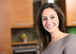 Portrait of young woman in kitchen