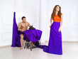 The beautiful girl with the man sew a dress