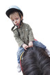 enfant faisant du poney