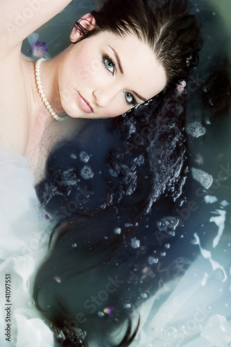 Photo: Woman relaxing in water Woman relaxing in water