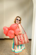 Beautiful woman with heart shaped baloons