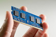 Hand holding DDR memory from notebook Technical support concept