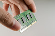 Hand holding DDR memory from notebook Technical support concept